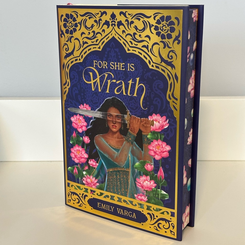 For She Is Wrath by Emily Varga - Gold and Blue Hardcover